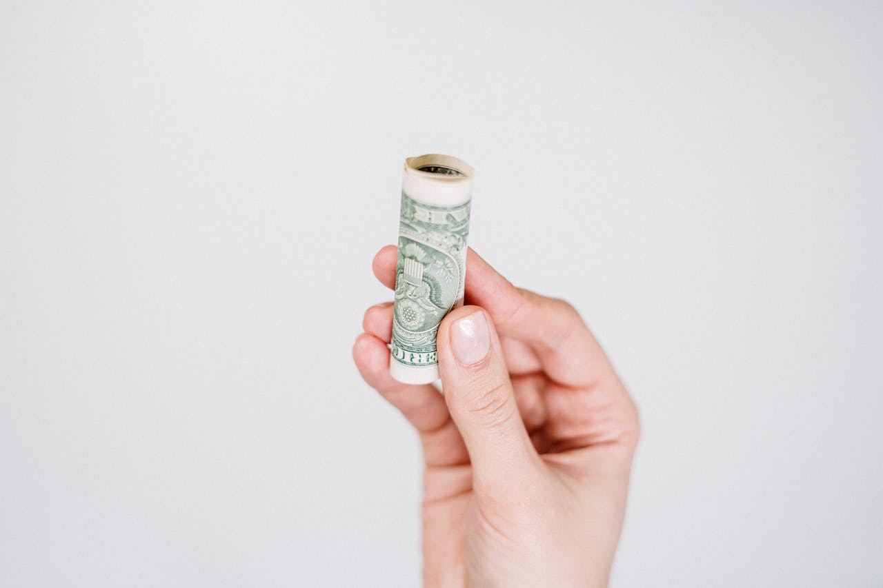 property owner holding rolled up bill