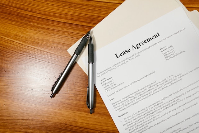 White paper with "Lease Agreement" printed in black letters at the top